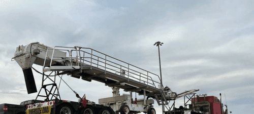Mobile conveyor unit staged for oversize transport